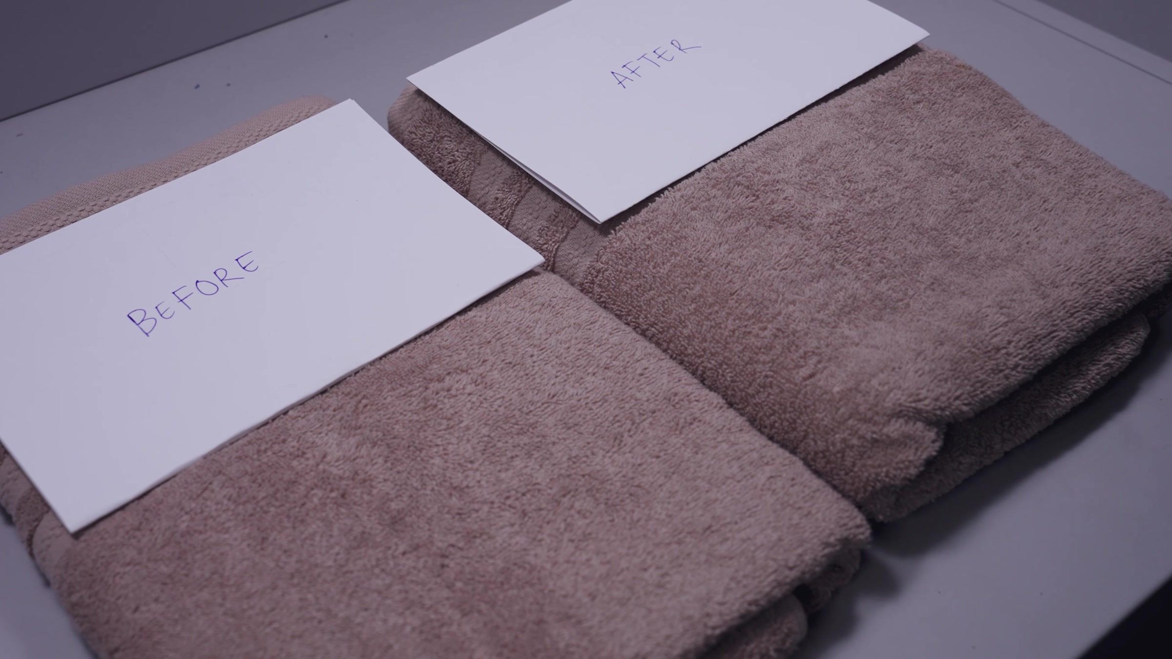 Two brown towels side by side, one card reading BEFORE and one AFTER.
